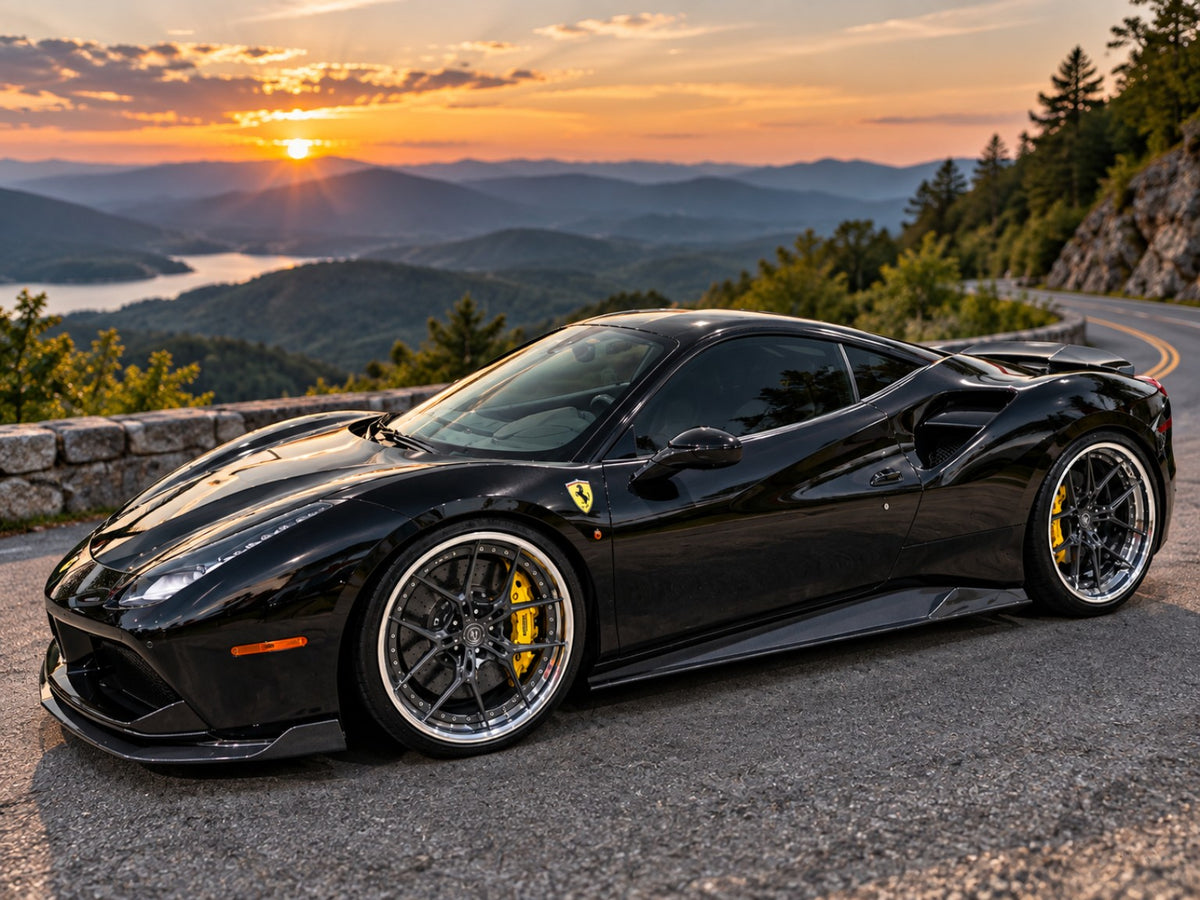 Black Ferrari on custom wheels at sunset